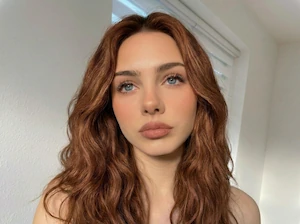 Auburn hair color transformation on a model using free AI hair color changer.