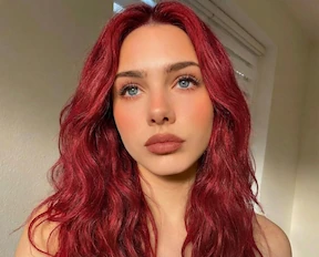 Vibrant Cherry Red hair color virtual makeover using AI algorithm.