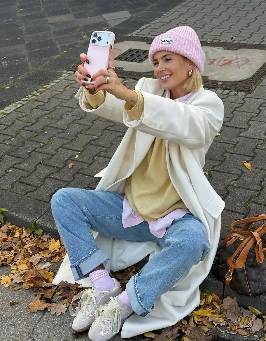 User in coordinated casual layers with pink accents, reflecting AI color analysis recommendations for undertone matching.