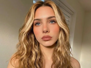 Woman with Honey Blonde hair style generated by AI hair color changing tool.