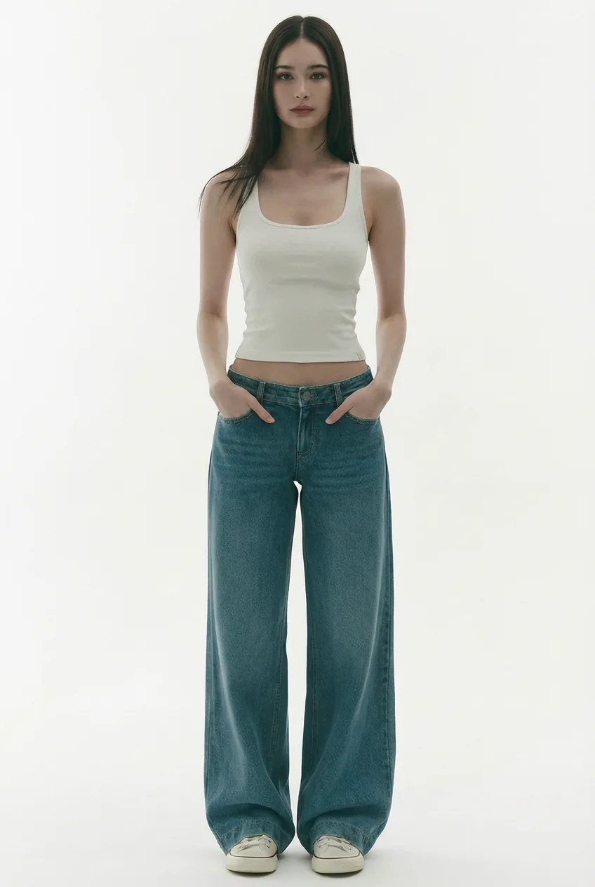 East Asian woman model in a white tank top and dark blue jeans, for virtual try-on with the AI outfit changer.