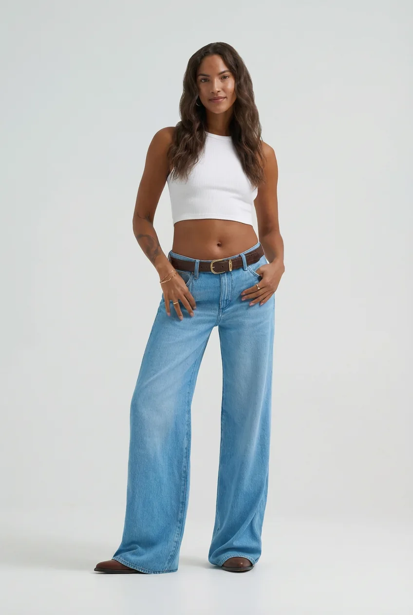 Mixed-race woman model in a white crop top and light blue jeans, for try-on via the AI closet generator.